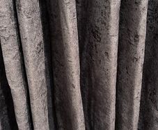 Grey curtains with extensible curtain pole