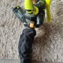 Limited edition This Action Man Air Patrol figure from Hasbro is a 12-inch electronic toy featuring a propeller backpack.The figure wears a distinctive neon yellow and gray flight suit and includes a helmet with a yellow visor. Image 4