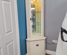 Corner cabinet with light.
