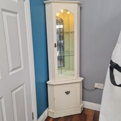 Corner cabinet with light.