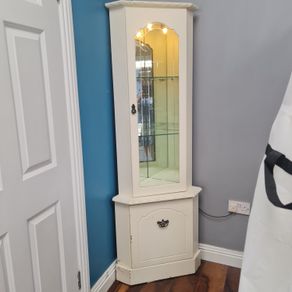 Corner cabinet with light.