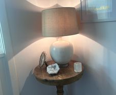 ez living ceramic table lamp in soft cream/white with a ribbed textured base and natural linen