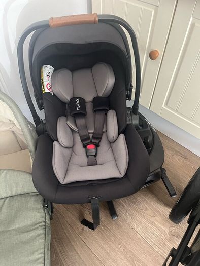 Nuna travel system including isofix base