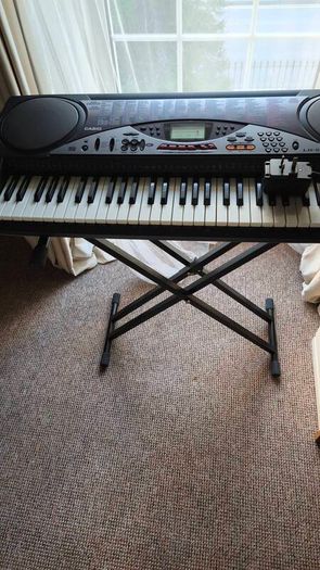 Casio keyboard LK 50 with a stand