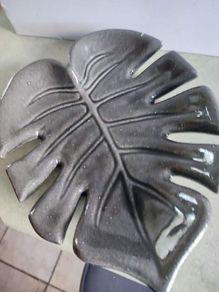Handmade Ceramic Monstera Leaf Fruit dish it's olive green colour..