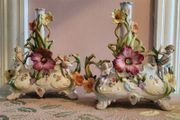 19th century pair of handpainted floral cherub porcelain candleholder/budvases