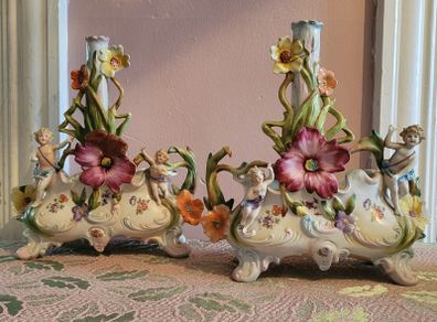 19th century pair of handpainted floral cherub porcelain candleholder/budvases