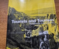 First Edition. Tourists and Tourism. Identifying with People and Places