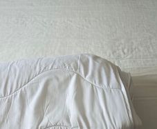 Double bed with mattress and mattress topper