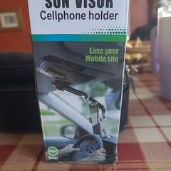 Sun visor mobile phone holder