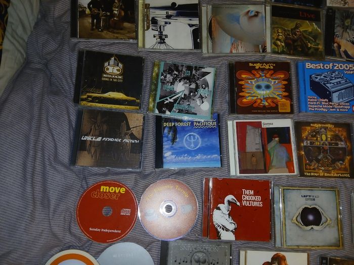 Collection of 58 assorted music CDs
