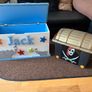 x2 Toy storage boxes Personalized white toy box features a light blue cushioned seat, the name "Jack" and pirate plastic box with lead Image 2