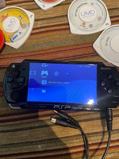 PSP  Console plus 10 games, charger and headphones