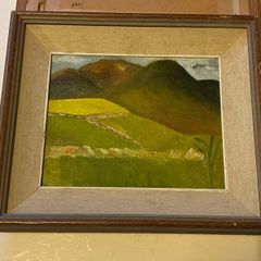 An original regional landscape painting depicting a mountainous Irish rural scene with traditional dry-stone walls, rolling green pastures, and a patch of bright yellow crop or gorse under an overcast sky