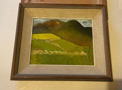 An original regional landscape painting depicting a mountainous Irish rural scene with traditional dry-stone walls, rolling green pastures, and a patch of bright yellow crop or gorse under an overcast sky