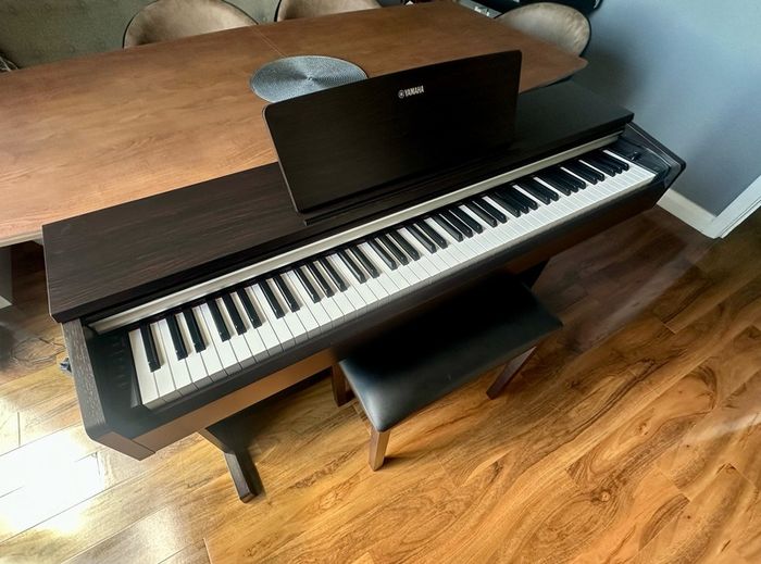 Yamaha Arius YDP-142 Digital Piano with rosewood finish and matching stool