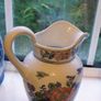 Faux Flowers in Pretty Jug. Image 3