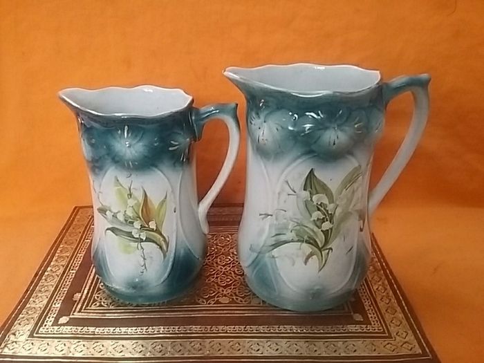 Two Graduated Antique Jugs