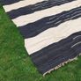 HAND-WOVEN INDIAN RUG FOR IMMEDIATE SALE Beautiful hand-woven rug crafted in India, measuring 2.4m x 3.5m. This quality piece features traditional craftmanship& would make a stunning addition to any room. The rug is in good condition overall, with 0ne Image 2