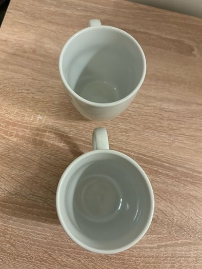 A Pair of Porcelain Cow and Pig Mugs