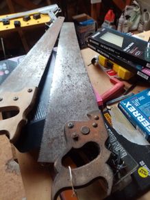 2 old hand saws