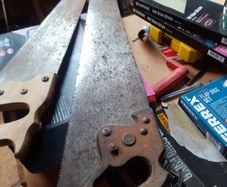 2 old hand saws