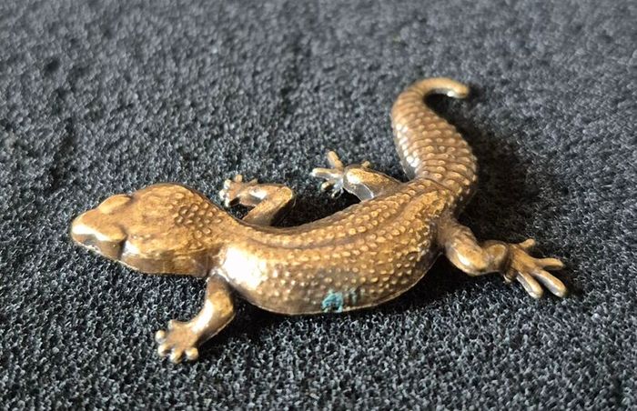 3 brass lizards.