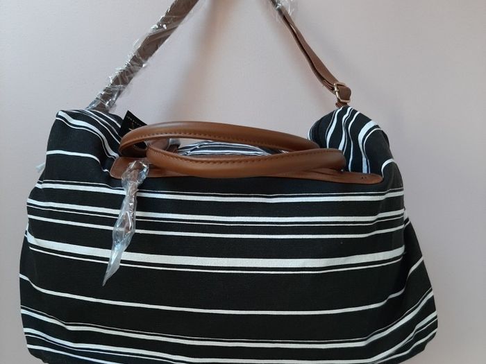 new Black and white stripe bag tag attached