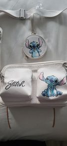 Stitch crossbody bag with matching purse.