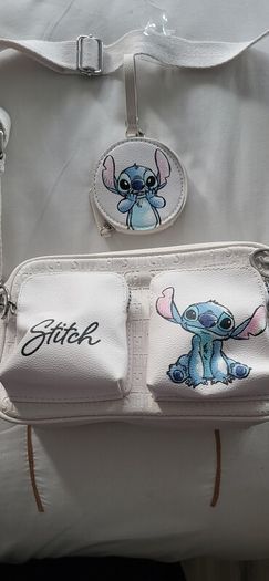 Stitch crossbody bag with matching purse.