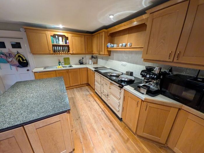 Solid wood kitchen with granite island