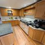 Solid wood kitchen with granite island Image 4