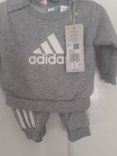 New baby boy bundle with tags .Consists of Addidas tracksuit . Name it top .Hat and gloves .pack of 7 pair socks .2 pair of rattle socks and free sunhat new  and green cable jumper all new  17 euro the lot