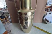 Neoclassical style embossed brass vase - of amphora form, the cylindrical neck flanked by two handles, tapering to an embossed, foliate body, 33cm,