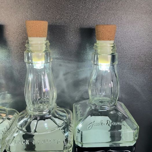 10 empty Jack Daniel bottles