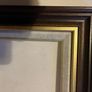 frame A rich dark-wood and gilt picture frame featuring a textured fabric mat liner. Image 8