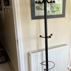Black metal coat rack with umbrella stand