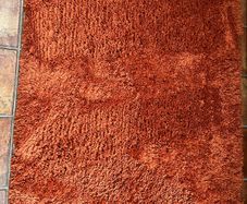 Kukoon terracotta/cinnamon colour shaggy rug 120 x170 cm