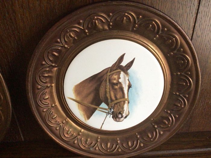 A pair of 10 inch copper wall hanging horses head plaques with hangers