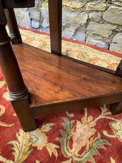 Early 20th Century solid oak gate leg drop leaf table.