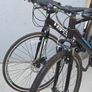 Two bikes one mountain one is a type of racing mountain bike Image 3