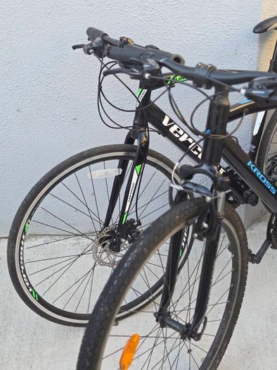 Two bikes one mountain one is a type of racing mountain bike