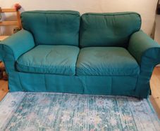 Dark green 2 seater couch in perfect condition