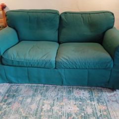 Dark green 2 seater couch in perfect condition