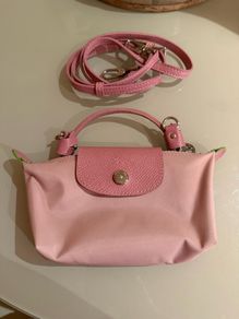 pink Longchamp Le Pliage mini top-handle bag with a detachable shoulder strap