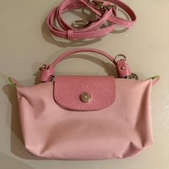 pink Longchamp Le Pliage mini top-handle bag with a detachable shoulder strap