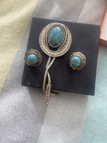 Vintage Southwestern bolo tie set with matching turquoise-style earrings. Silver-tone metal, Western/boho style, good vintage condition.