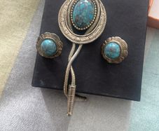 Vintage Southwestern bolo tie set with matching turquoise-style earrings. Silver-tone metal, Western/boho style, good vintage condition.