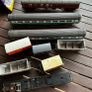 Some random parts for hornby trains. Included is 2 British rail coaches in need of repair. A Harry Potter coach. Also various goods trucks Image 2