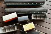 Some random parts for hornby trains. Included is 2 British rail coaches in need of repair. A Harry Potter coach. Also various goods trucks